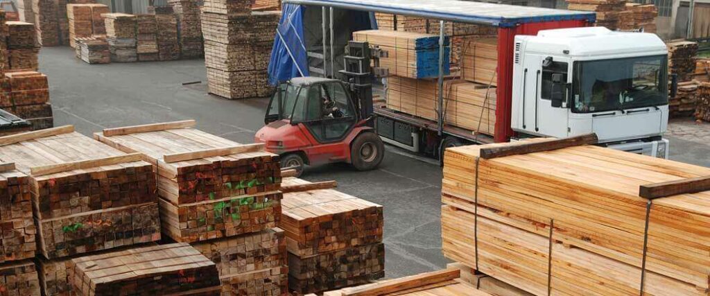 Pallets of wood boards loaded into a warehouse after being imported into the U.S.