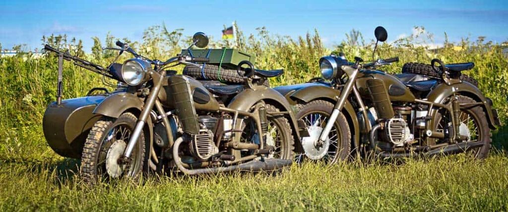 Two motorcycles in a field
