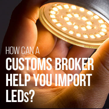 A person screws in an LED bulb