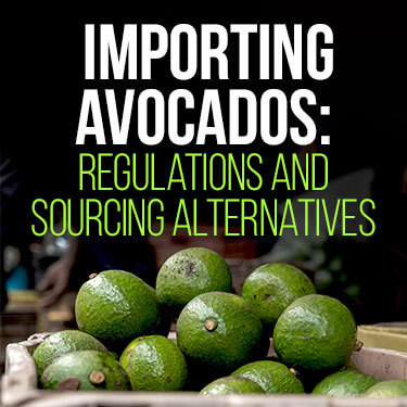 Stack of green avocados in a basket