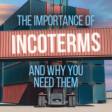Cargo containers being stacked by a forklift