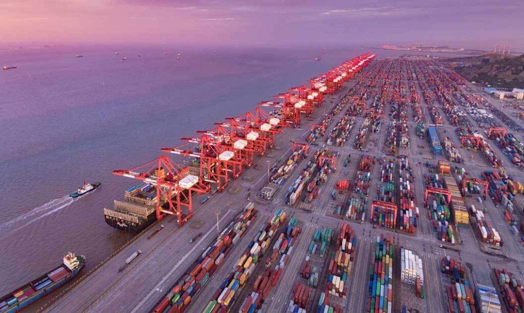 overhead view of dockside container terminal at sundown