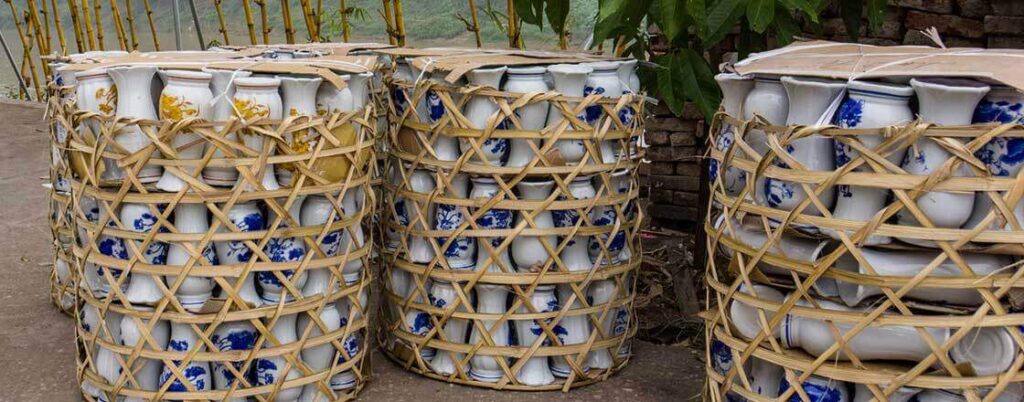 Multiple ceramic items stacked in baskets