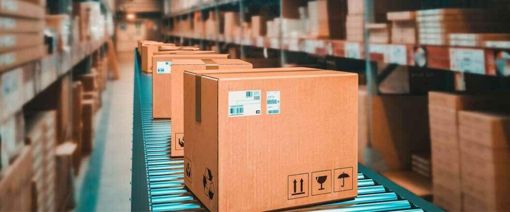 Boxed merchandise on a conveyor belt, portraying a key facet of how to import goods for resale.