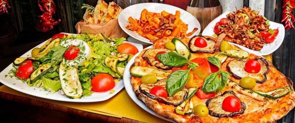 If you plan on importing food from Italy, you might prepare pasta, pizza, salads, and breadsticks such as those shown in this image.