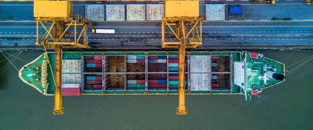 An over head view of a mostly unloaded cargo vessel.
