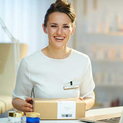 Importing Cosmetics - Cosmetics worker with labeled shipment package