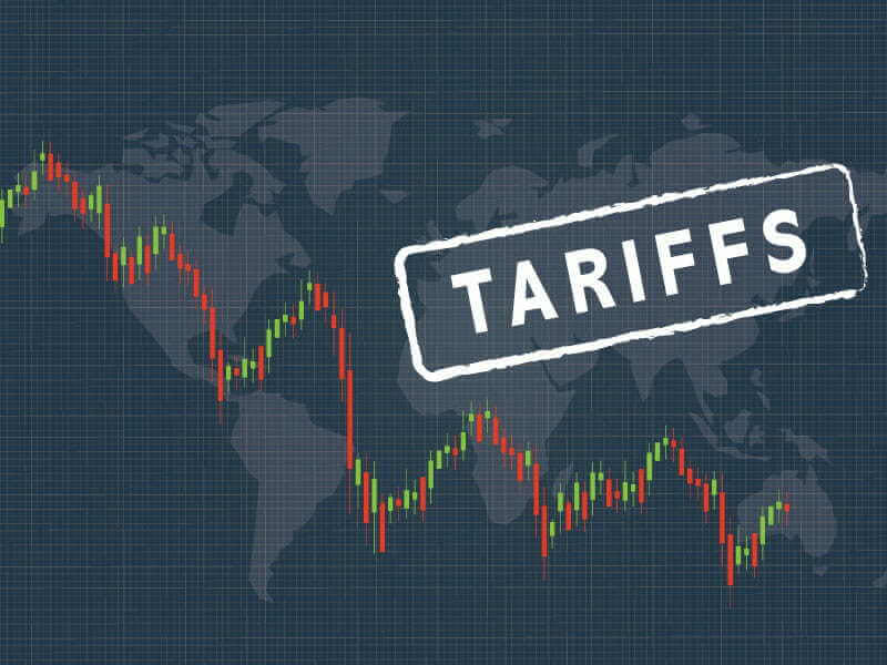 A digital image depicting a map of the globe in shades of gray with a line graph overlaid in the foreground and the word "Tariffs" stamped over northern Africa and Eurasia. supporting the article title "A Comprehensive Guide to Section 232 Tariffs"